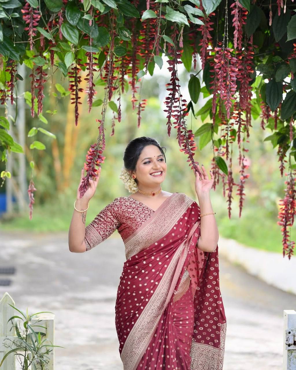 Elegant Maroon Soft Silk Saree with Rich Gold Zari Weaving, Intricate Traditional Border, and Graceful Festive & Wedding Wear Appeal