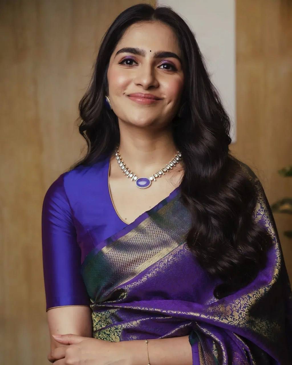 Royal Purple Soft Silk Saree with Elaborate Gold Zari Weaving, Premium Traditional Border, and Luxurious Festive & Wedding Wear Look